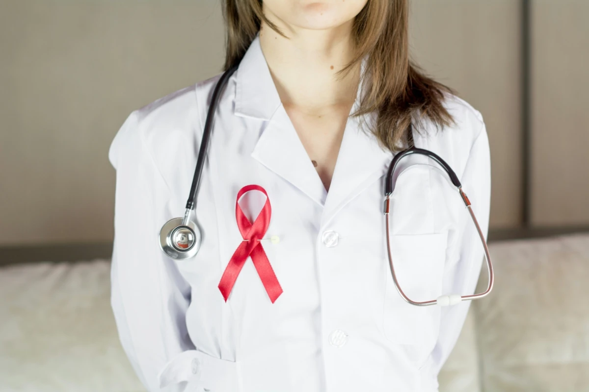 Woman doctor holding red ribbon HIV, world AIDS day awareness ribbon. More of my photos and videos Adobe Stock:http://bit.ly/3RqlciK More of my photos and videos Shutterstock: https://www.shutterstock.com/g/ALEKSANDRBERDYUGIN My email: bermix999@gmail.com